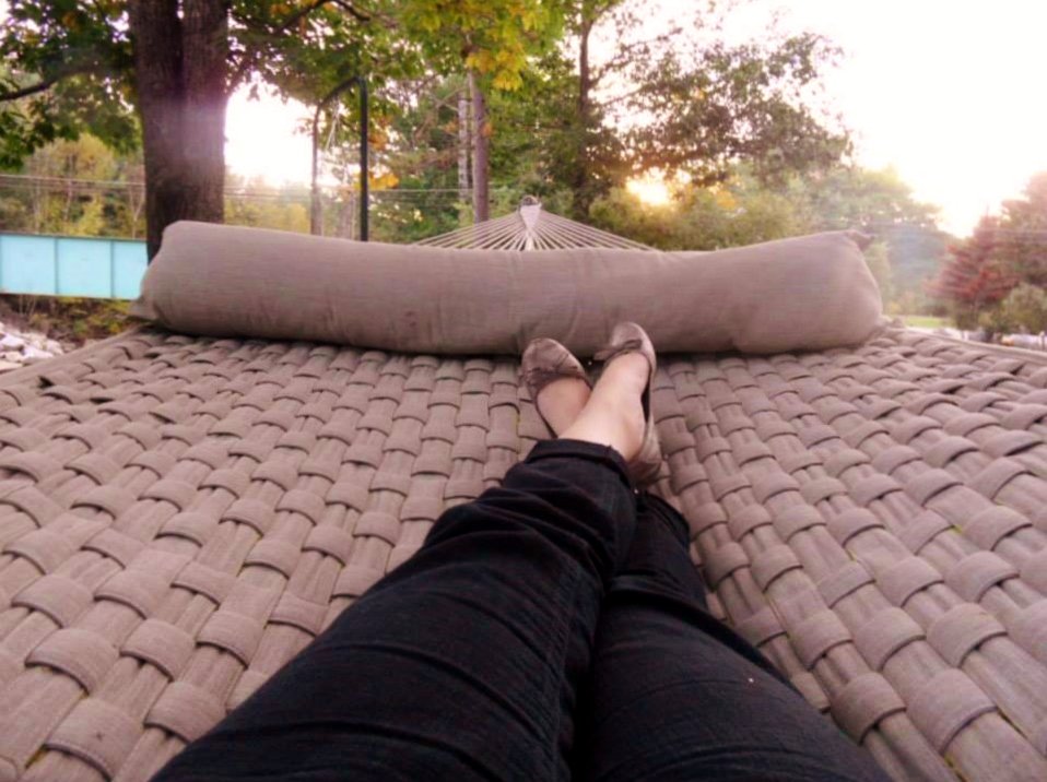 Relaxing in a riverside hammock